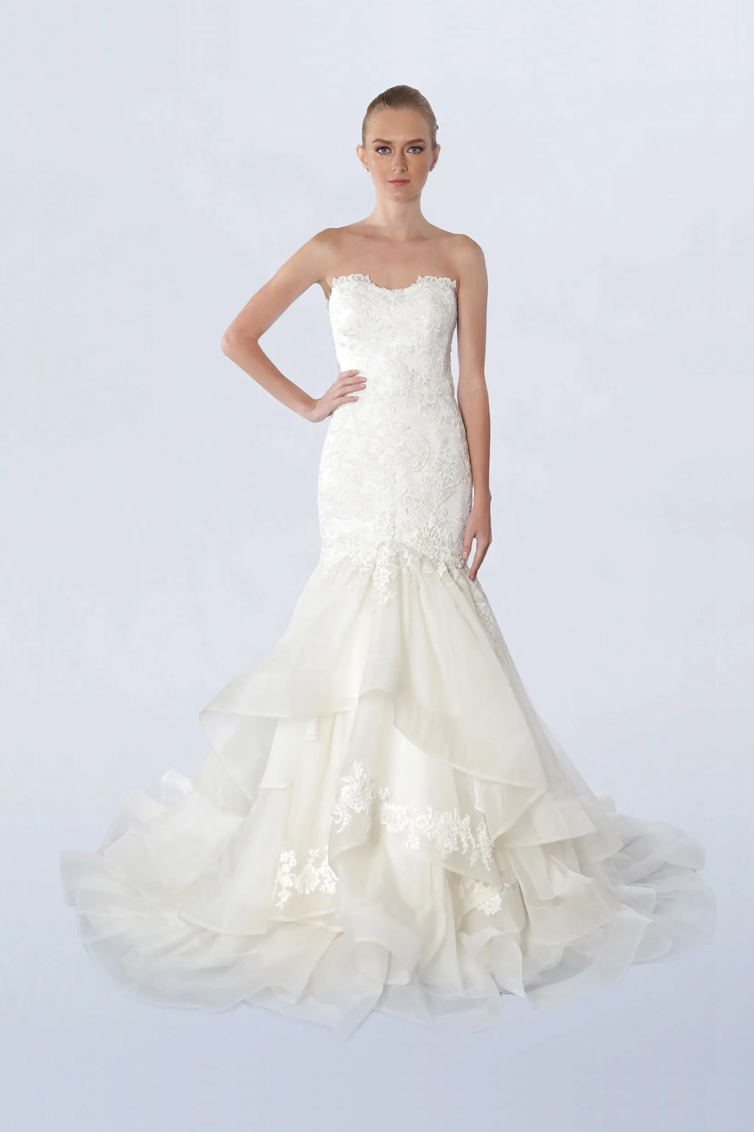 Front view of a woman in a strapless white mermaid gown 2, image 1