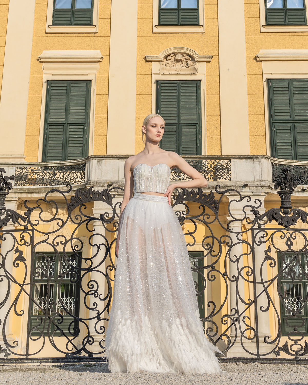 Woman in a white corset and sequin overskirt. 10, image 1