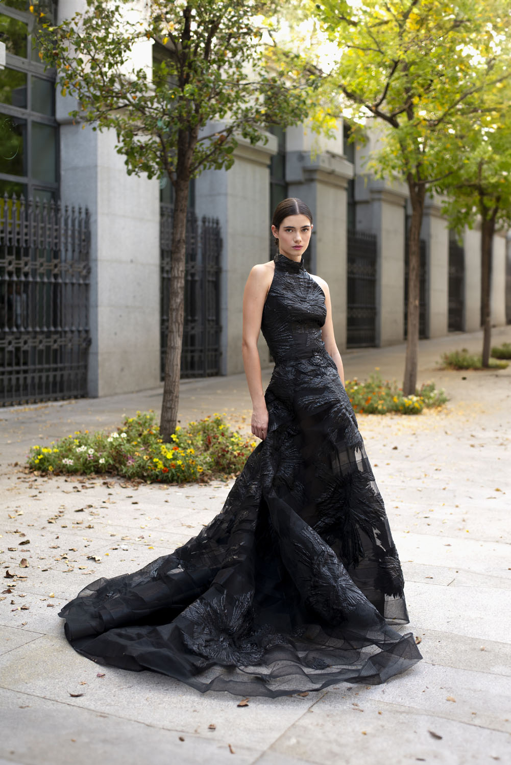 Front view of a woman in black brocade gown. 17, image 1