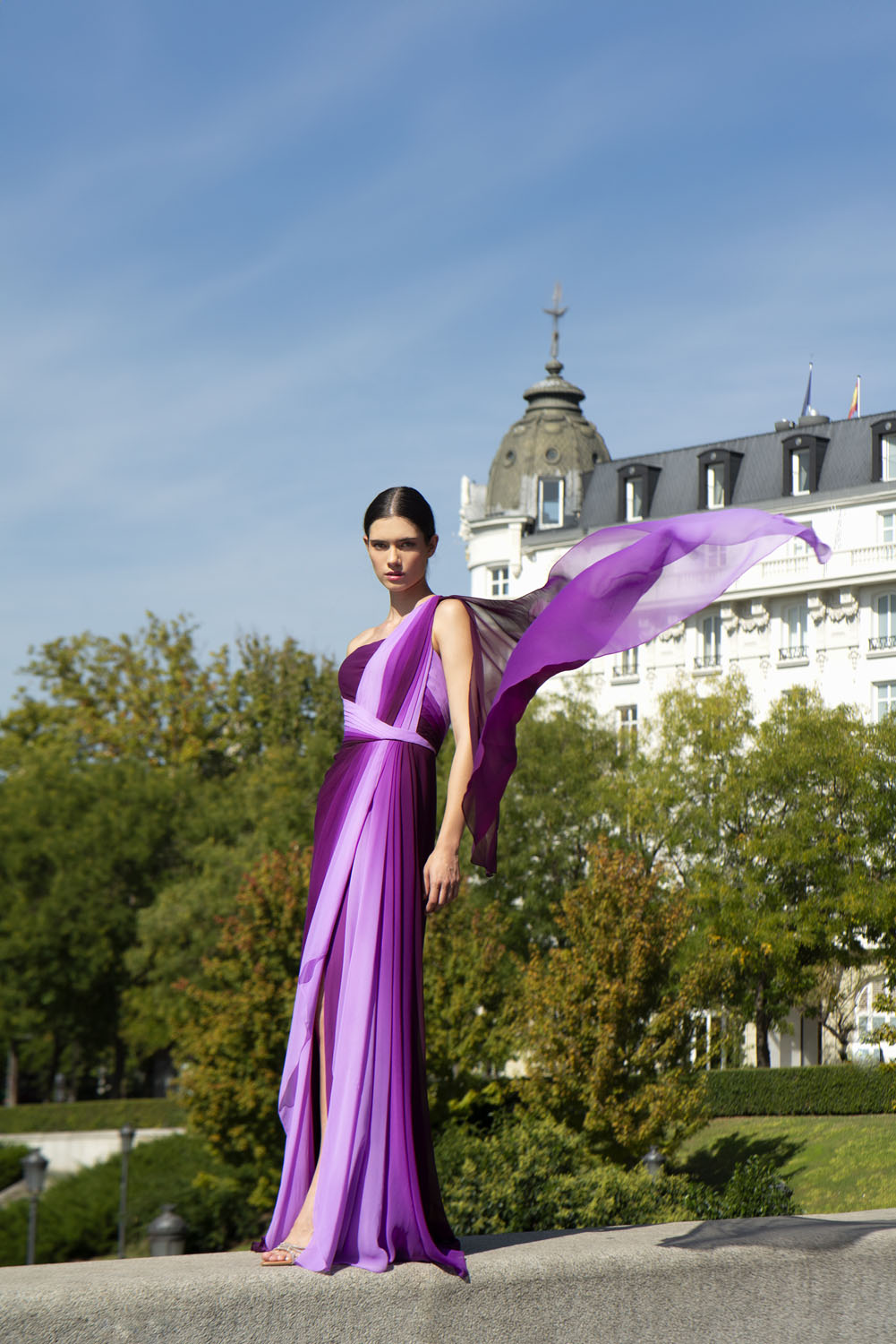 Front view of a woman in a purple gown. 19, image 1