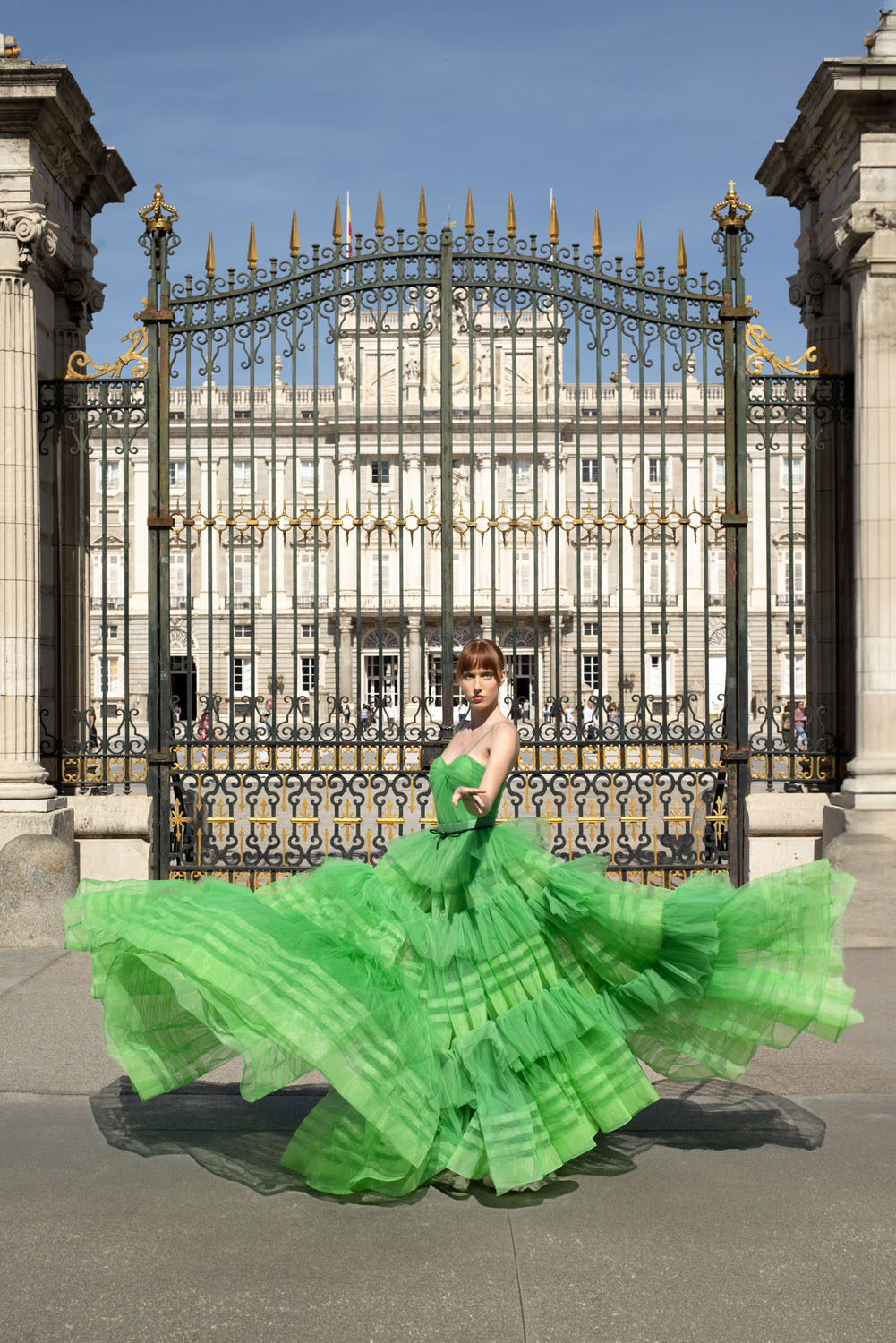 Woman in a green bodysuit and skirt. 21, image 1