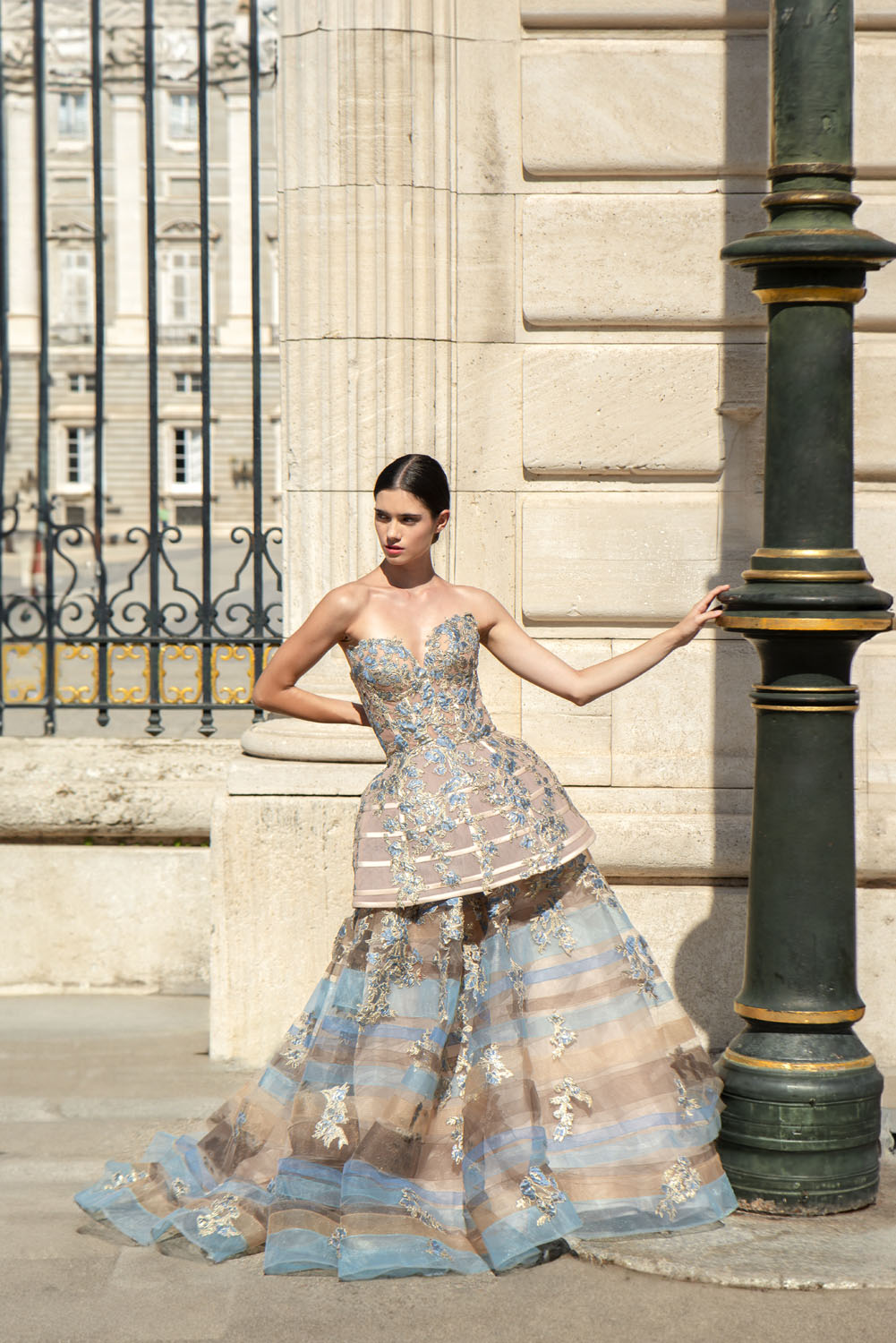 Woman in a beige with blue applique cocktail dress with brown and blue strips tulle underskirt. 22, image 1