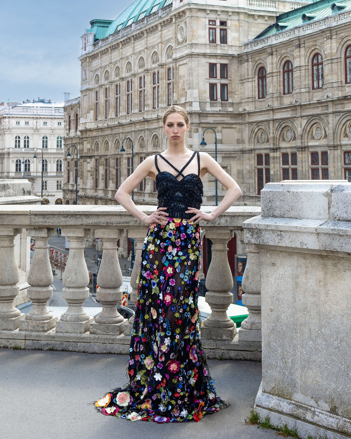 Woman in a black and multicolored floral gown. 4, image 1