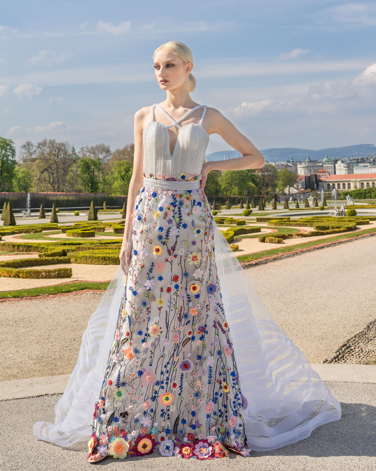 Woman in a White and floral gown with white tulle train. 5, image 1
