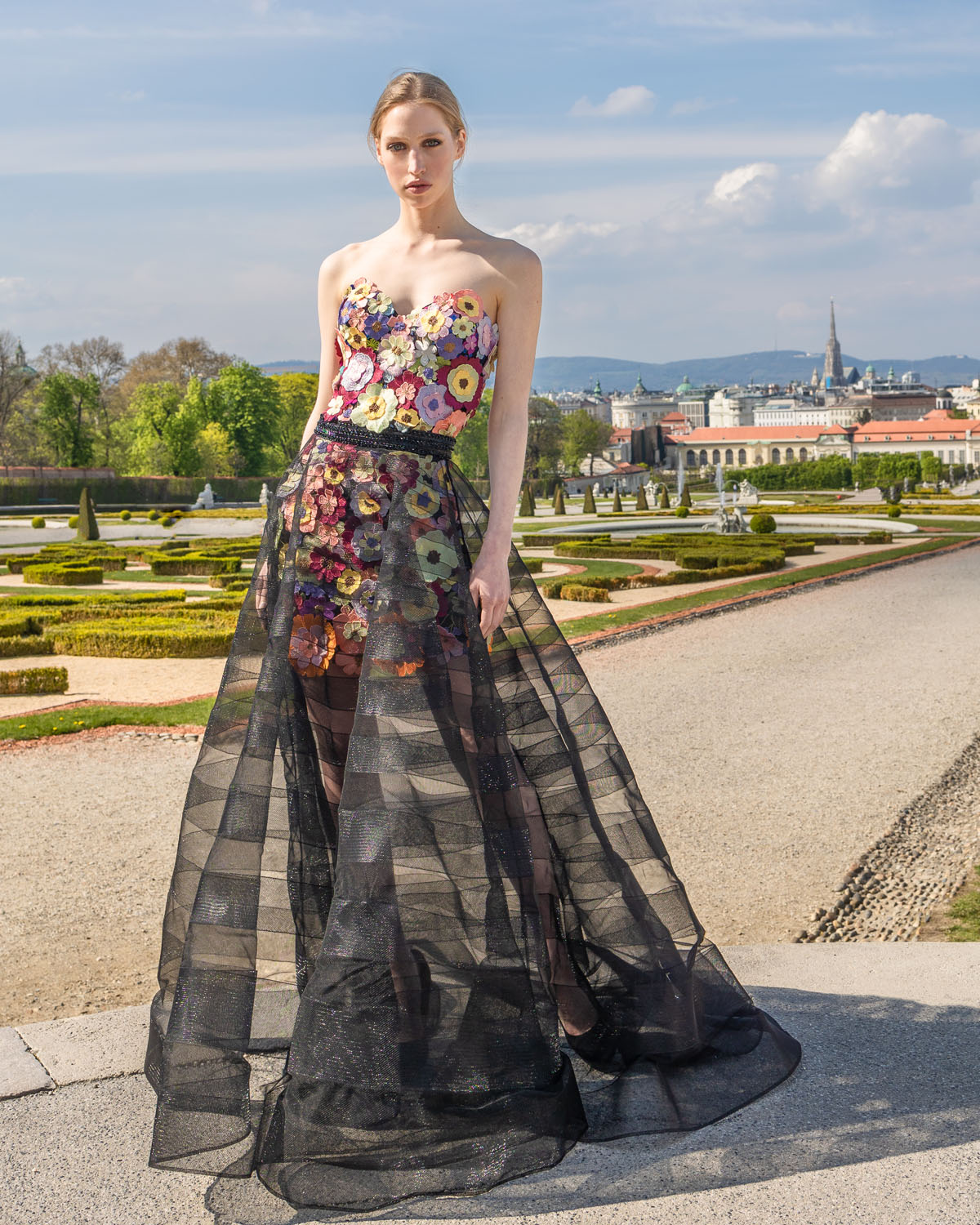 Woman in a multicolored floral corset and skirt, and black tulle overskirt 6, image 1