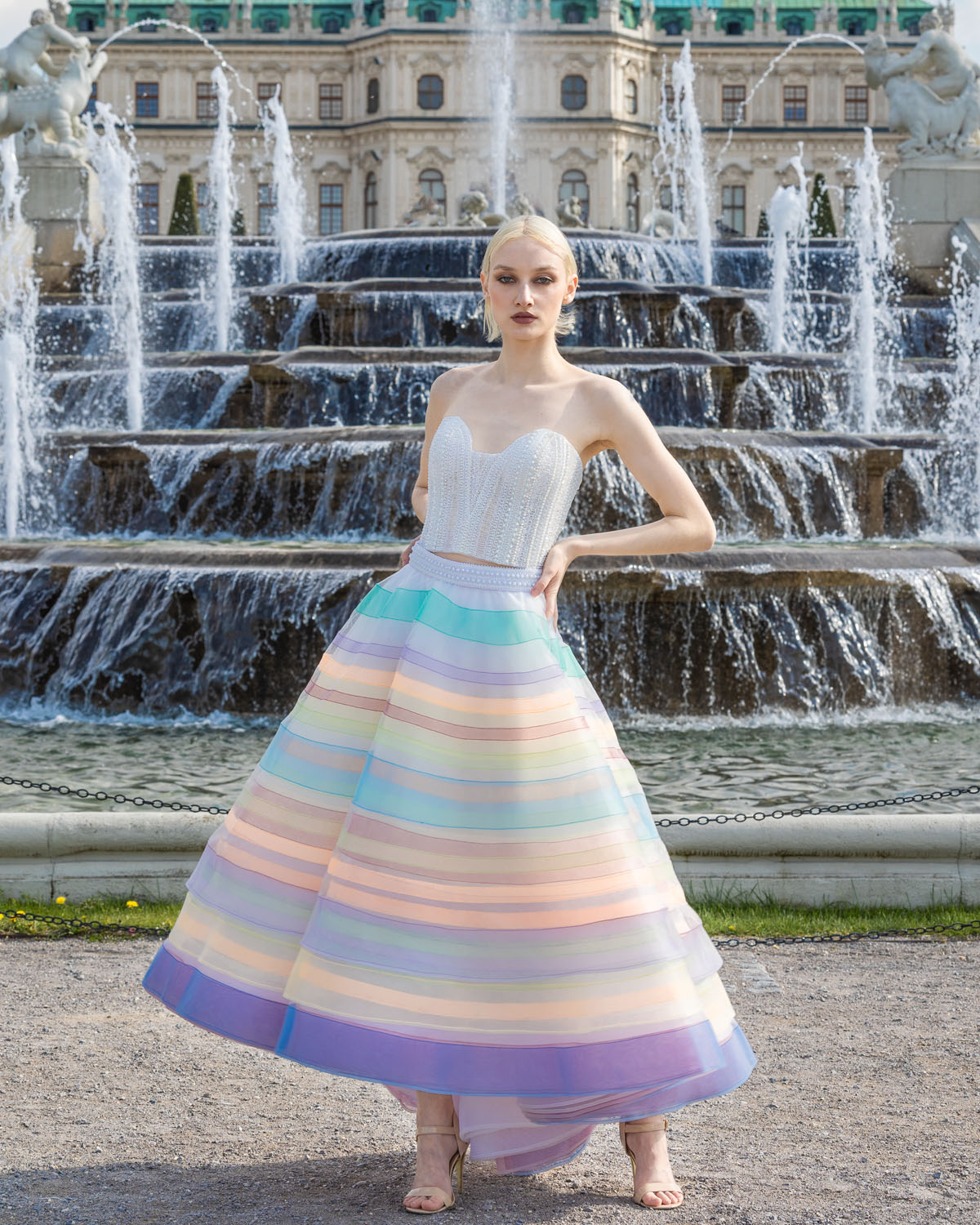 Woman in a white corset and multicolored stripe ball skirt. 7, image 1