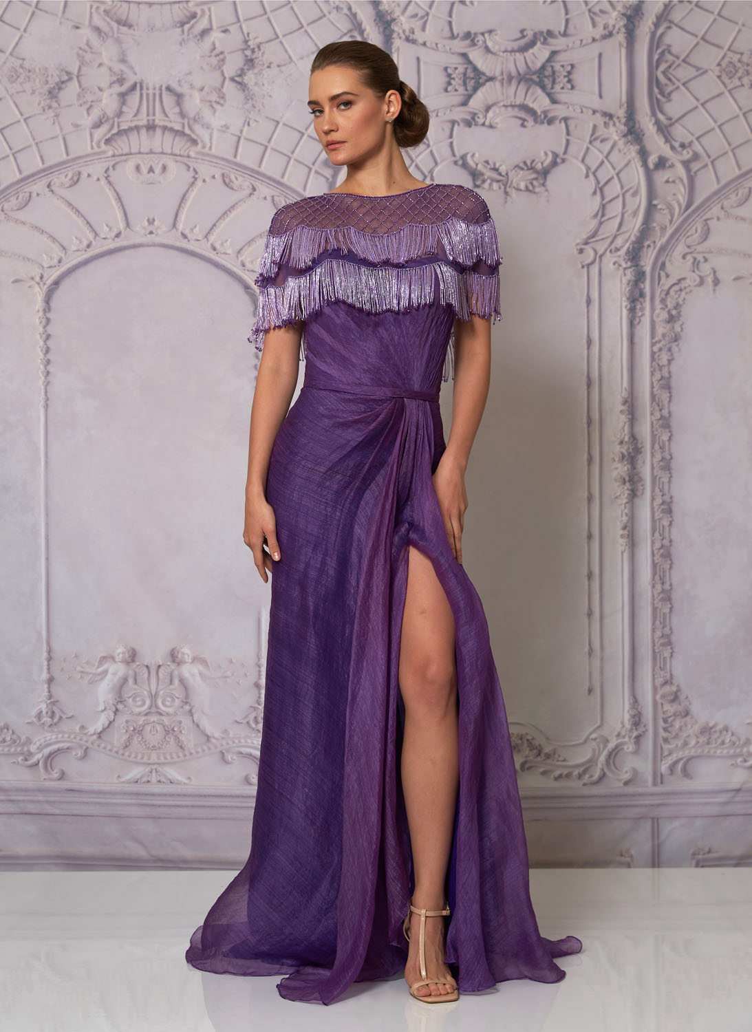 Front view of a woman in a purple gown and beaded poncho 2, image 1