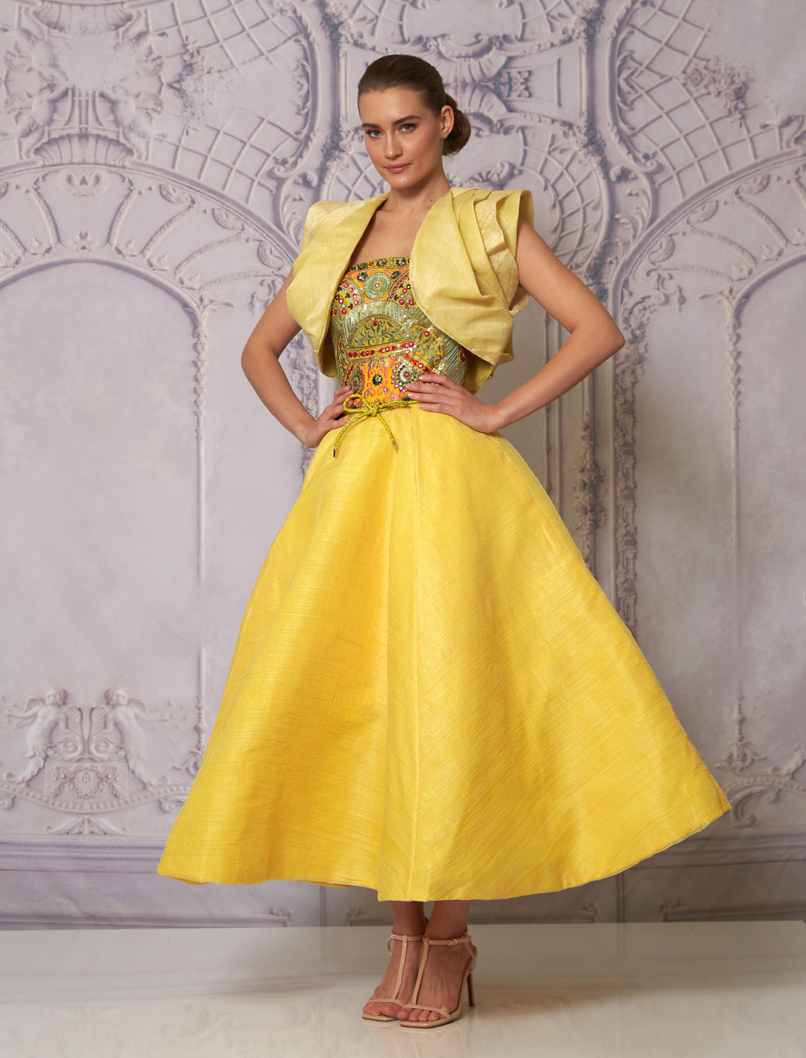 Front view of a woman in a yellow balloon skirt dress and bolero 7b, image 1