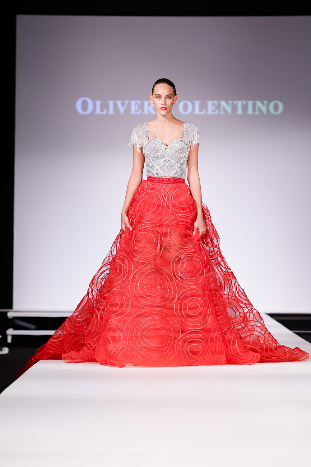 Silver embellished top, and red ball skirt