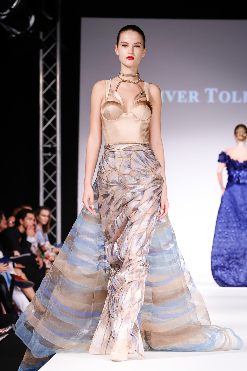 Beige top, column skirt, and tulle train