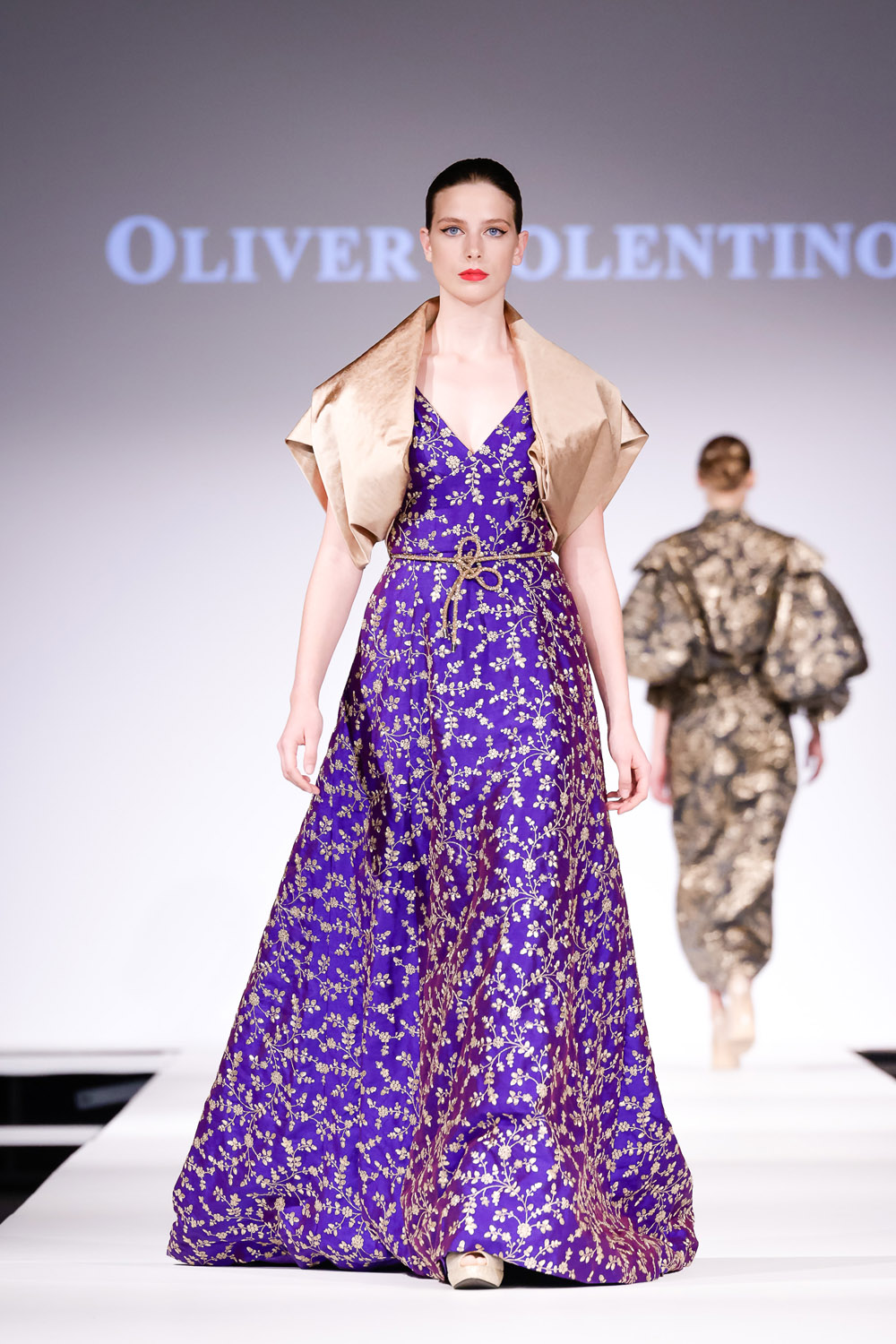 Purple and gold embroidered ball gown, and gold shrug