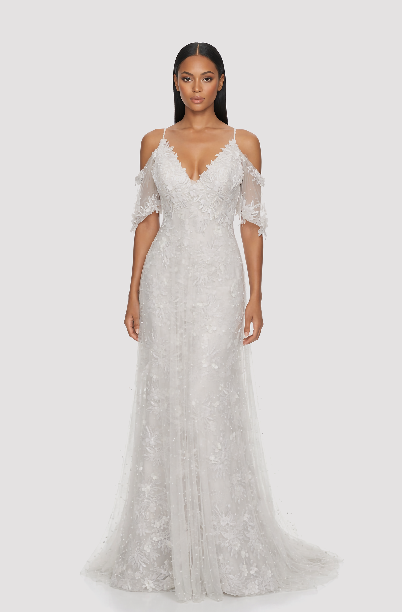 Front view of a woman in an Off-white v-neck off-shoulder lace sleeved mermaid gown with overlay tulle bodice 1, image 1