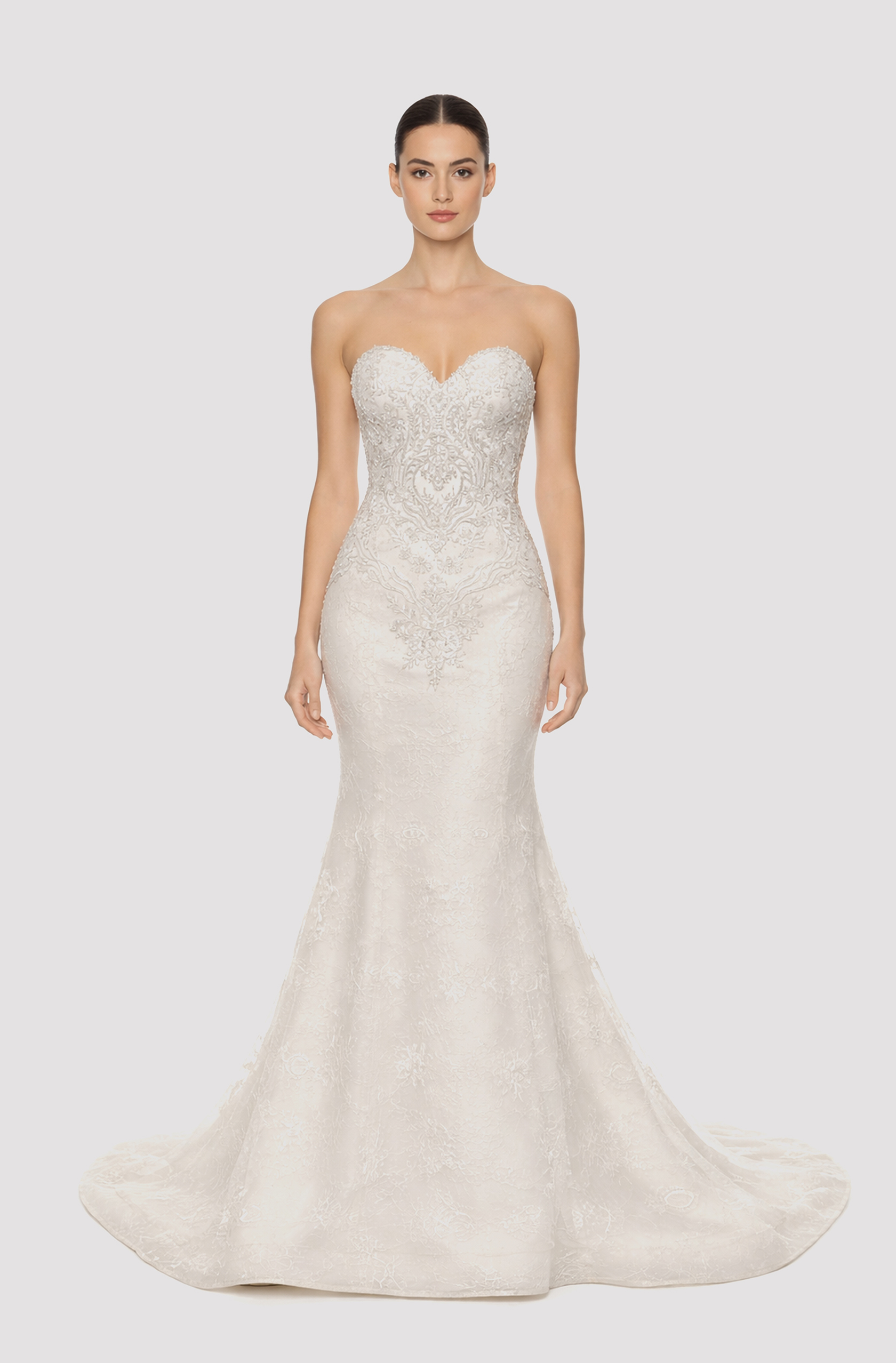 Front view of a woman in an Off-white French lace sweetheart neckline mermaid gown with hand-beaded applique bodice 11, image 1
