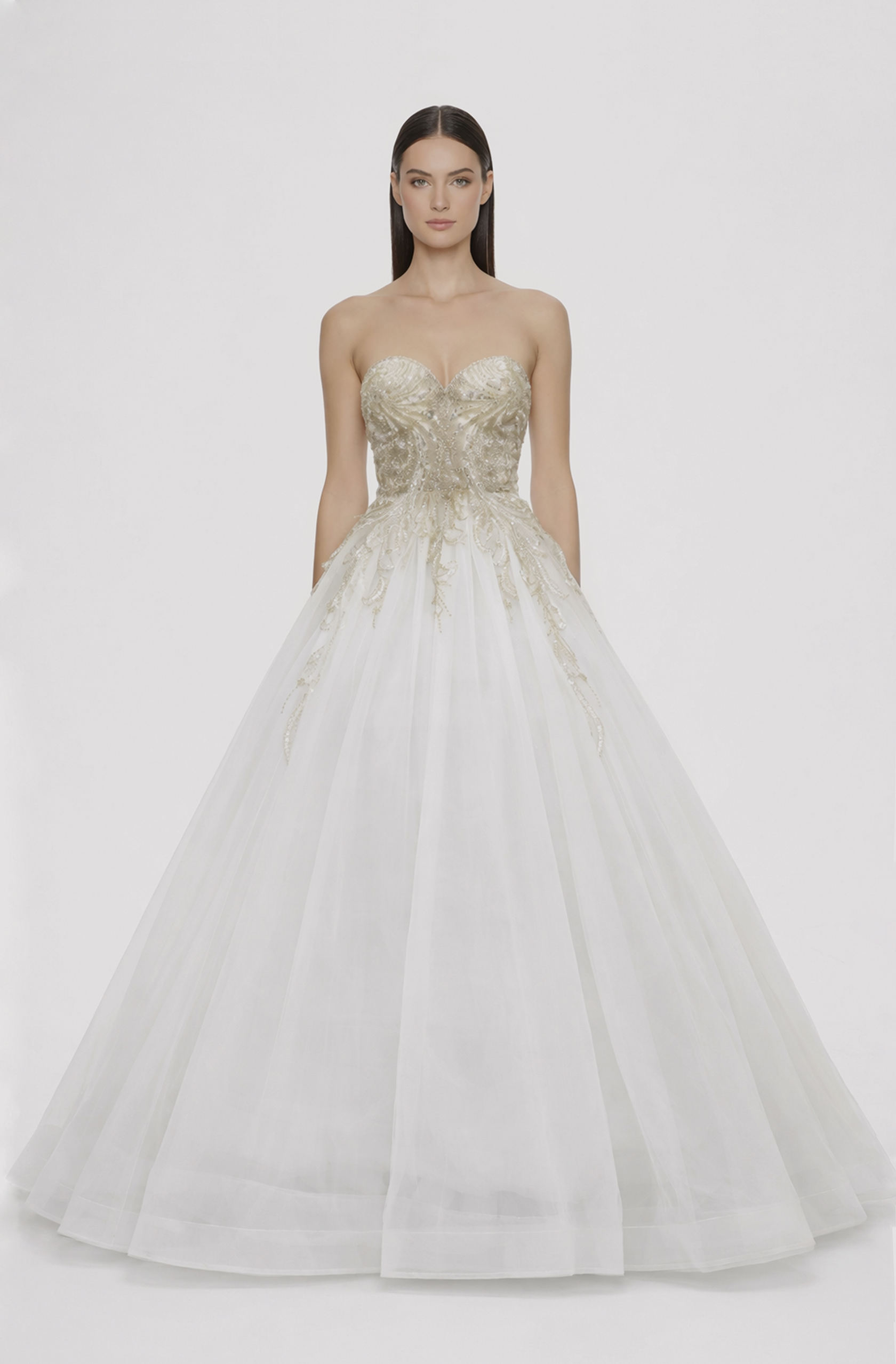 Front view of a woman in an Off-white tulle ball gown with cascading hand-beaded bodice 18, image 1