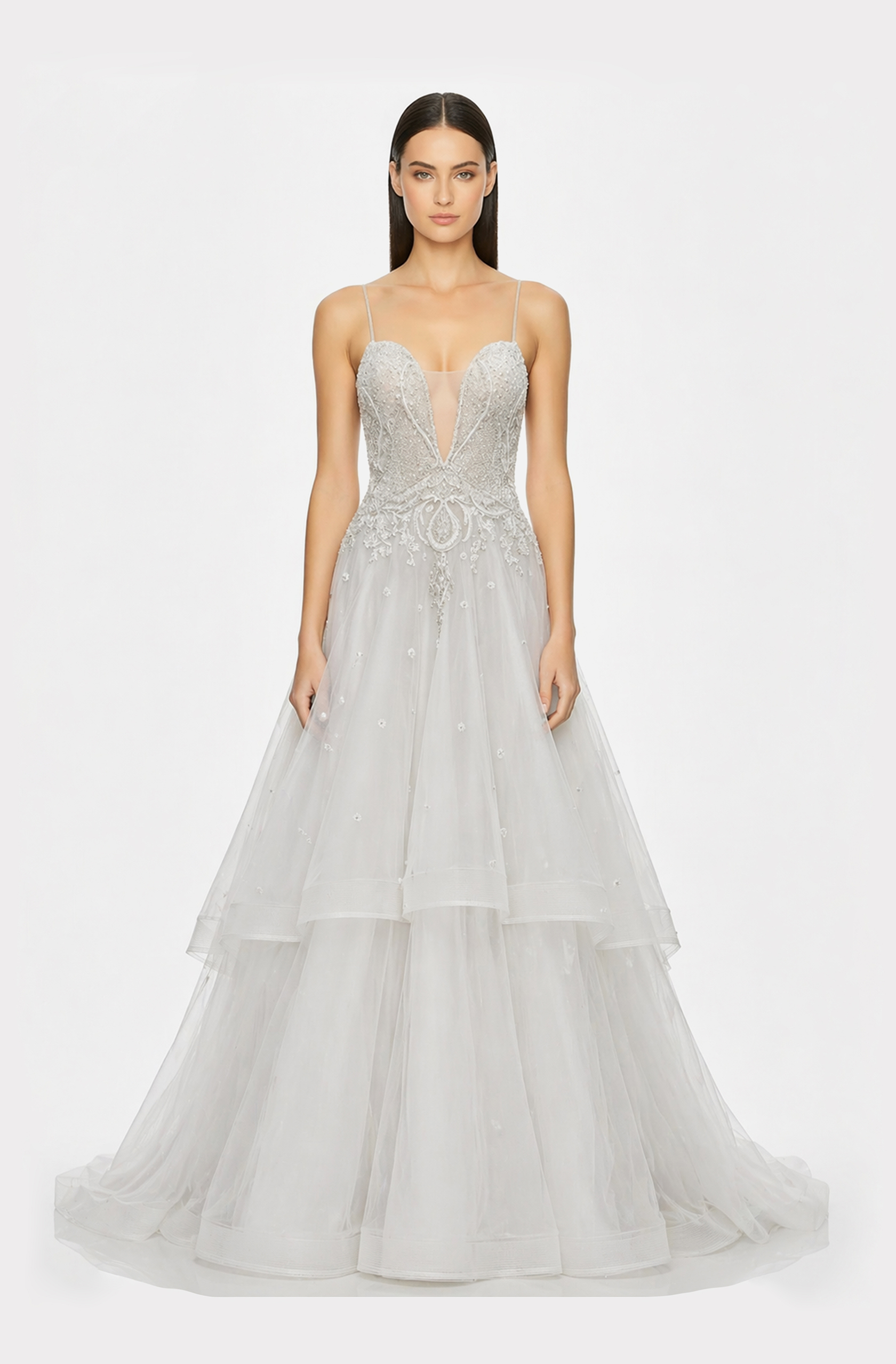 Front view of a woman in an Off-white tulle deep neck ball gown with silver hand-embroidered, hand-beaded applique 25, image 1