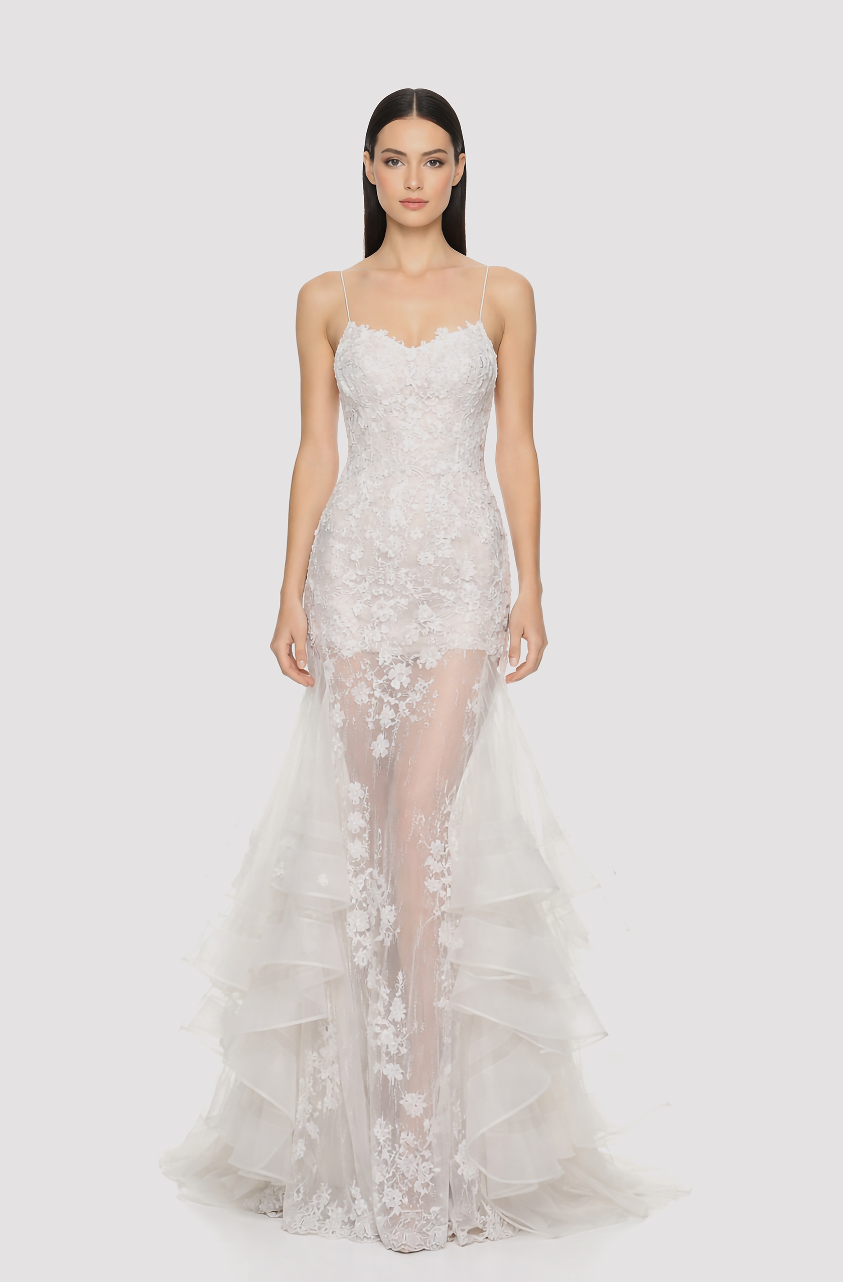 Front view of a woman in an Off-white tulle ruffled mermaid gown embellished with lace applique and 3D flowers 3, image 1