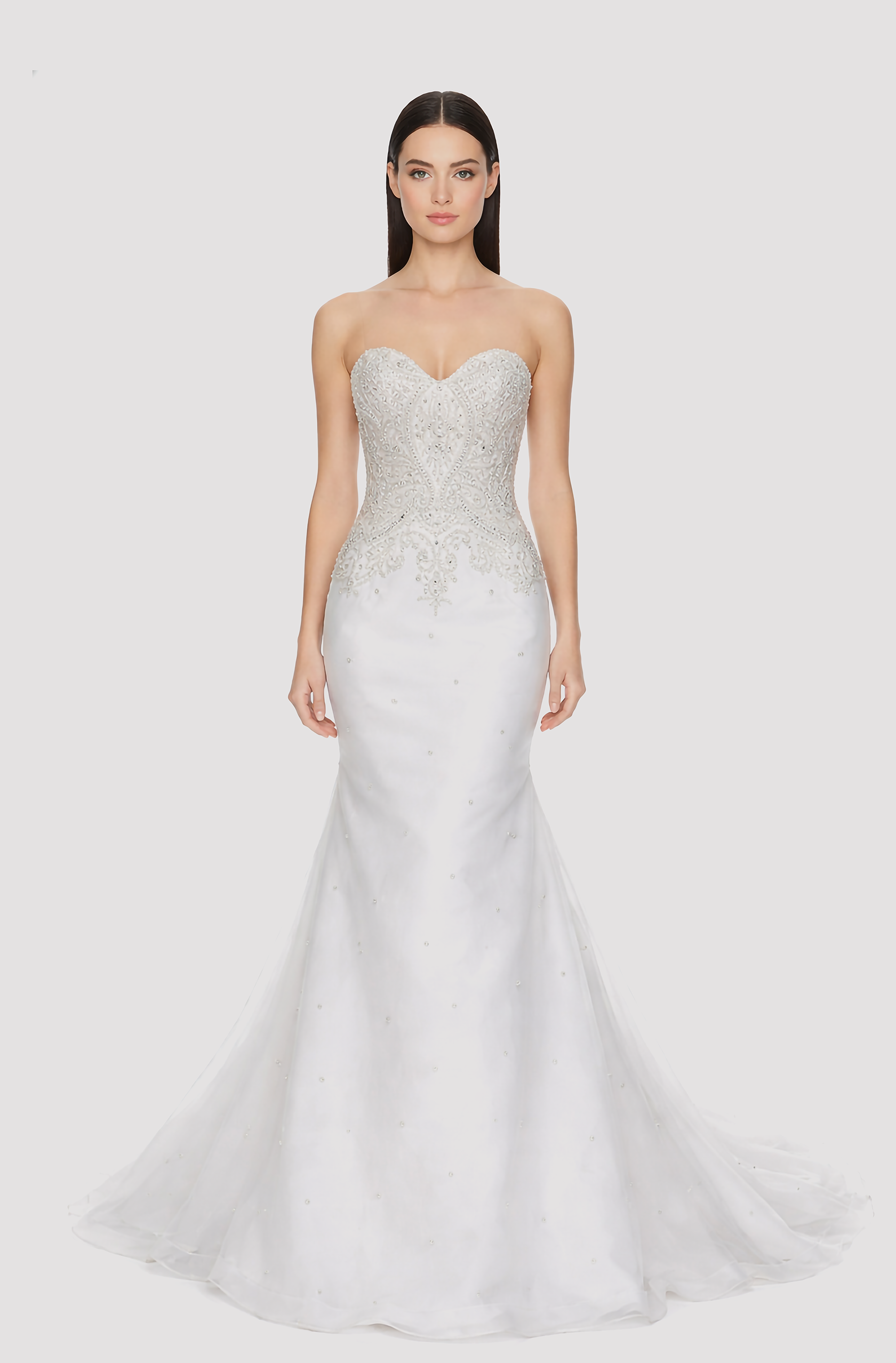 Front view of a woman in an Off-white tulle mermaid gown with silver hand-embroidered, hand-beaded bodice 6, image 1