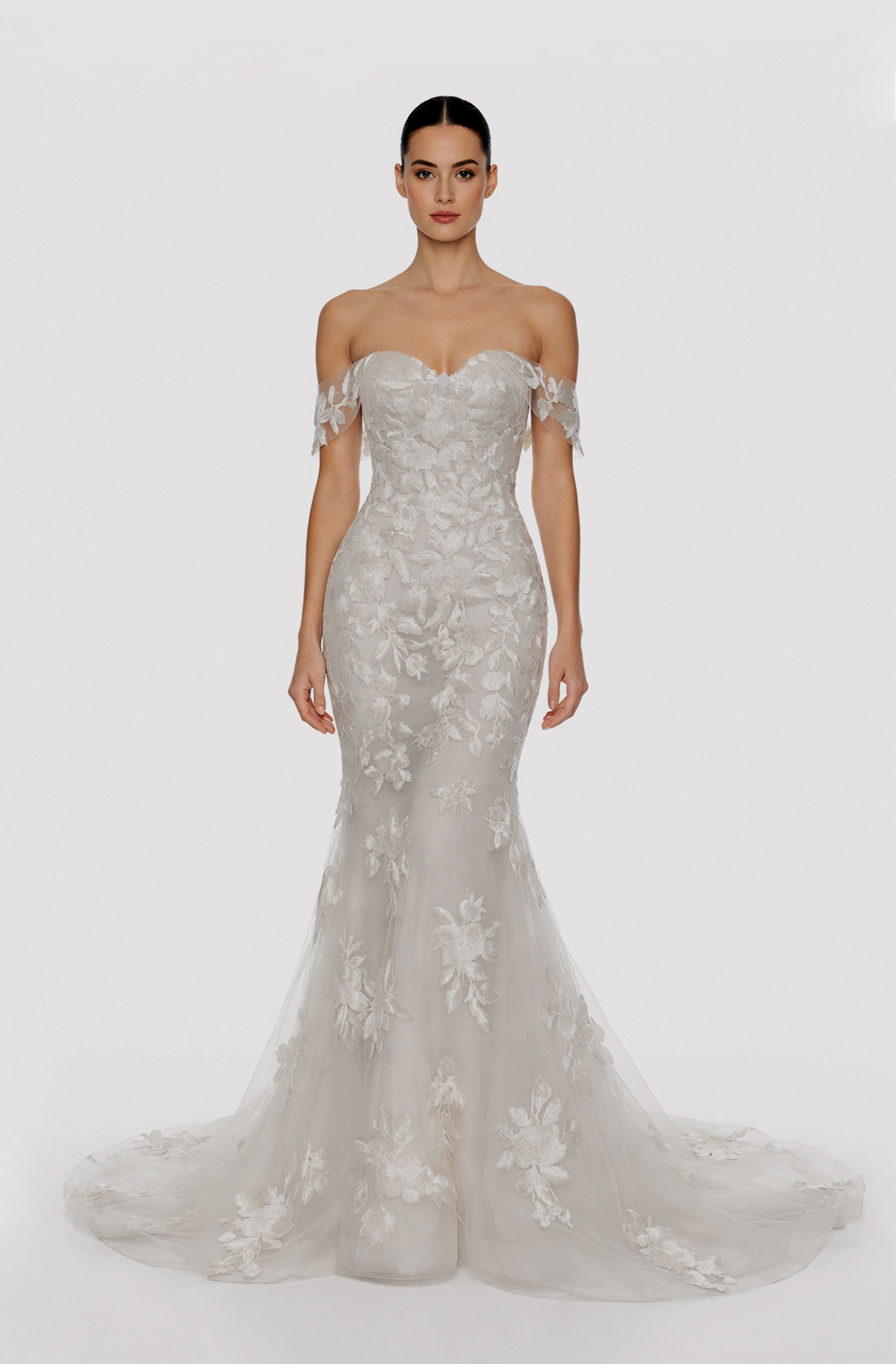 Front view of a woman in an Off-white tulle, off-shoulder sleeved mermaid gown embellished with cascading laces 9, image 1