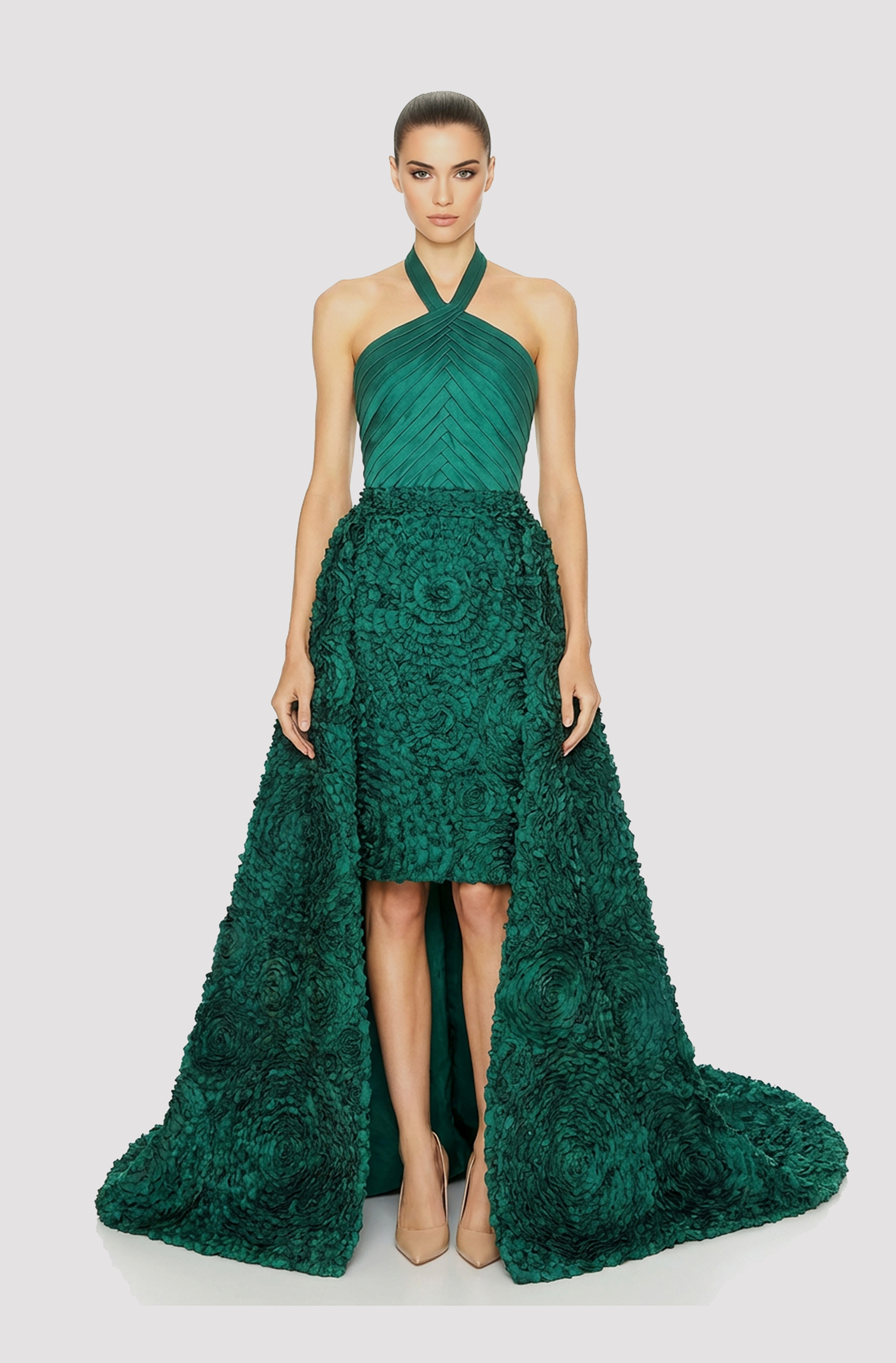 Front view of a woman in an Emerald green mikado halter couture dress with a pleated bodice and 3D floral skirt and detachable train 2, image 1