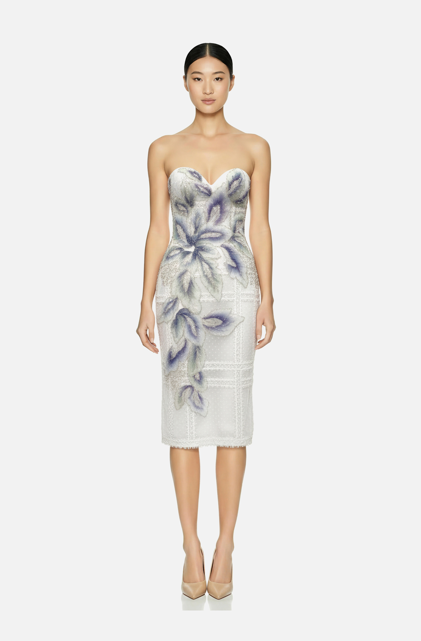 Front view of a woman in an Off-white dotted Swiss tulle corseted sheath dress with off-white strip lace appliqués and mint green, blue and purple beaded floral appliqués 50, image 1