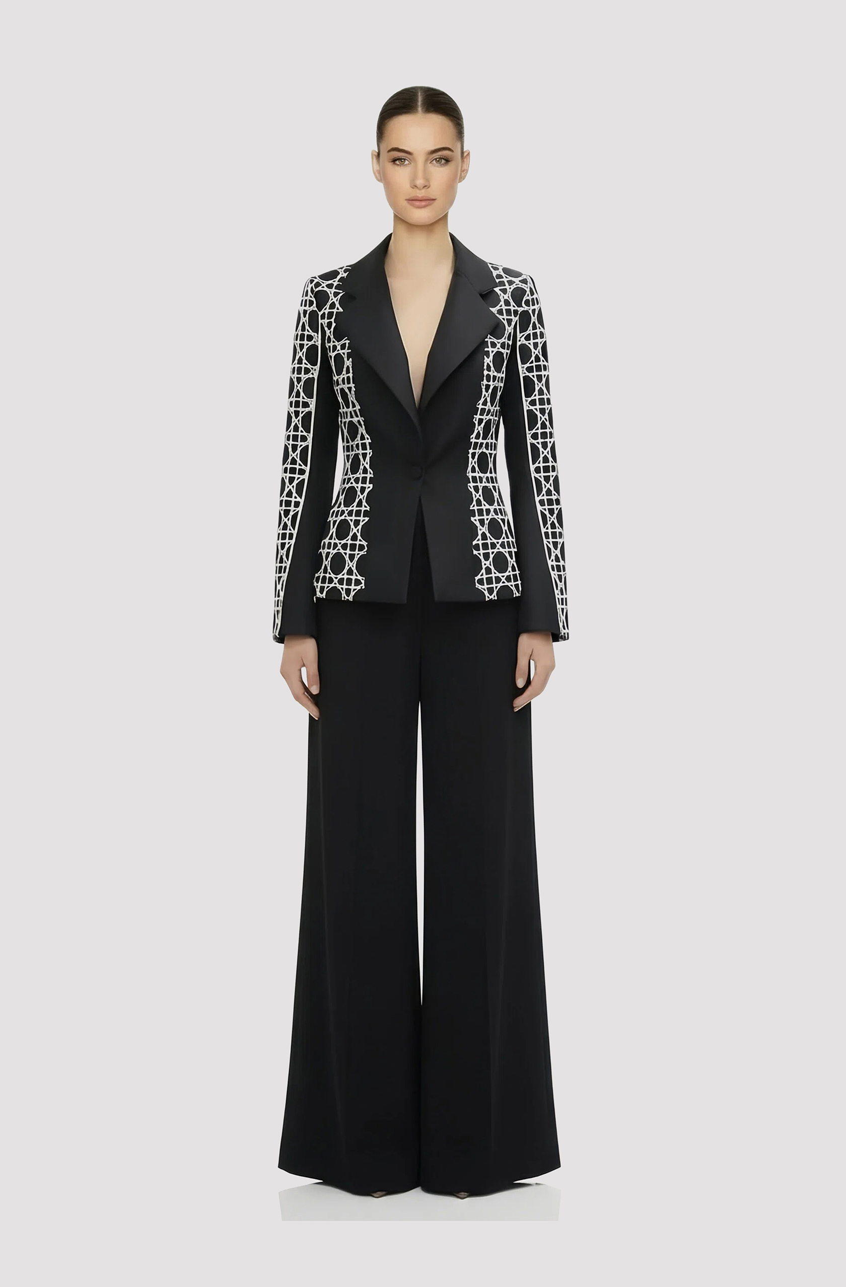 Front view of a woman in a Black & white custom printed mikado jacket with black palazzo pants 73, image 1