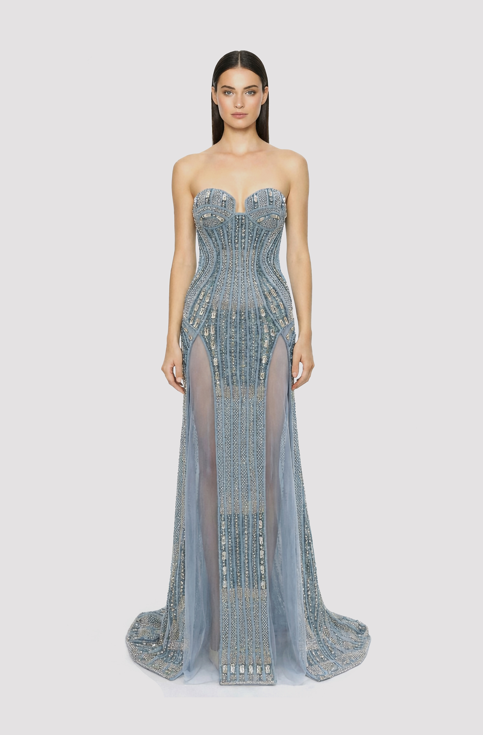 Front view of a woman in a Blue corseted couture hand-beaded mermaid gown with see-through side slits 28, image 1