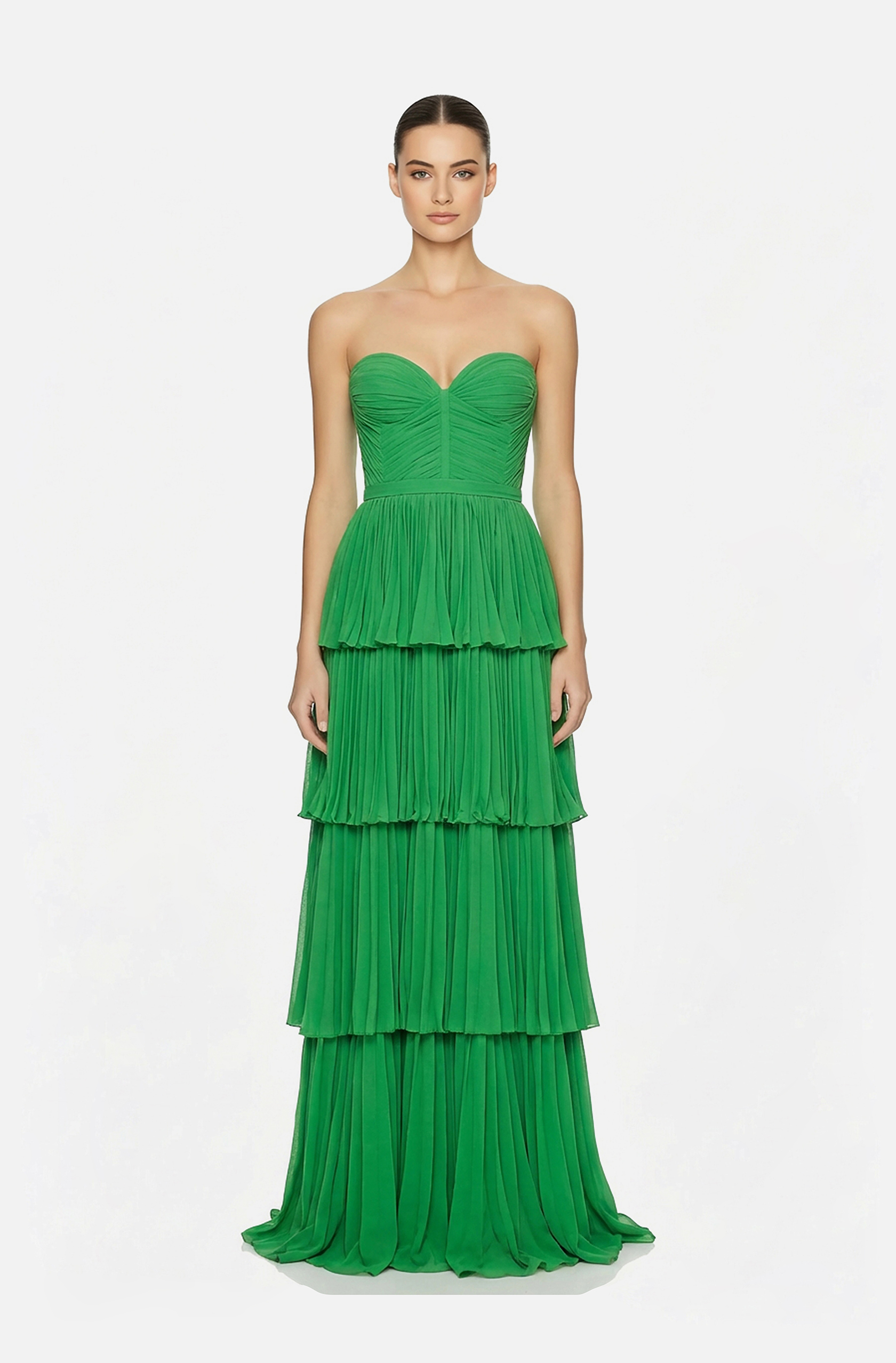 Front view of a woman in an Apple green strapless georgette gown with draped bodice and tiered pleated skirt 4, image 1