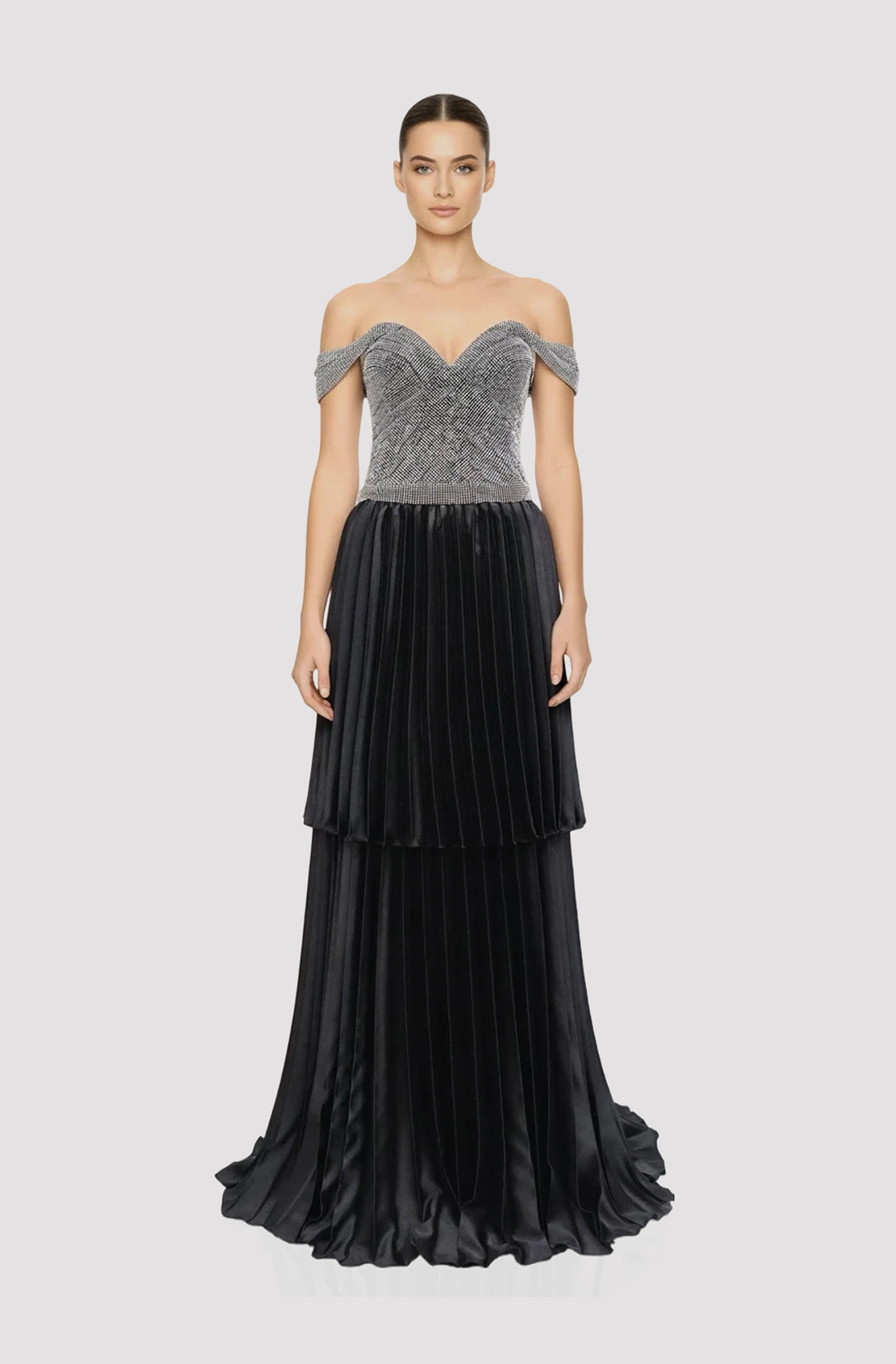 Front view of a woman in a Silver & black gown with chainmail corseted off-shoulder, drop-waist top, with two-tiered black satin electric pleated skirt 48, image 1