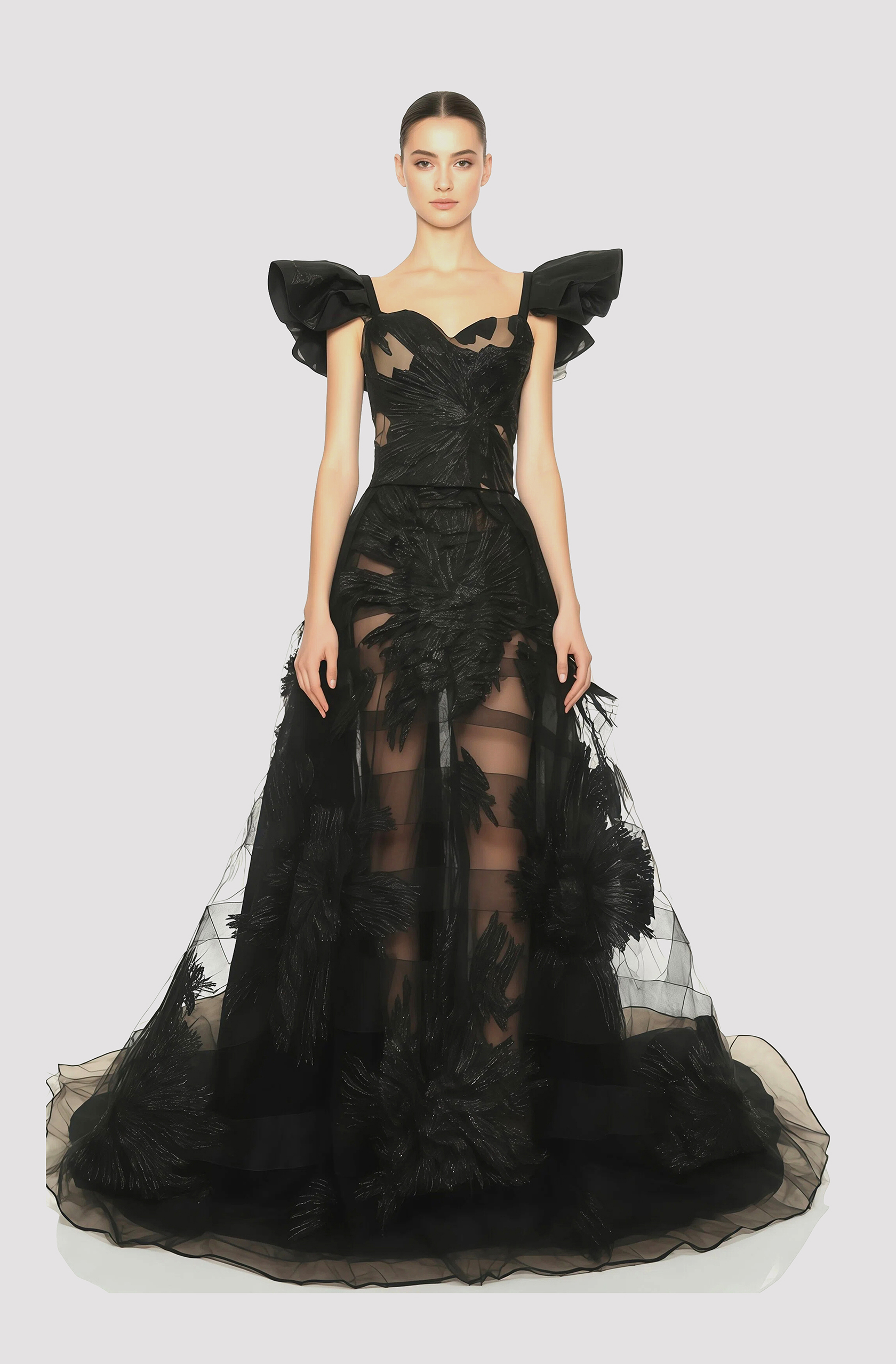 Front view of a woman in a Black two-piece floral lamé couture ensemble of corset with winged sleeves and a sheer tulle ball skirt accented with concentric horsehair strips 55, image 1